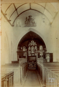 Photograph of nave, St.Mary's Lydiard Tregoze, with Royal Arms mounted above the chancel arch, 1896
