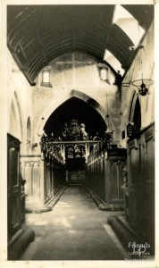 Photograph of nave of St. Mary's Lydiard Tregoze, showing chancel screen & Royal Coat of Arms, early twentieth century