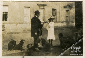 Photograph of Henry Hiscocks, Dorothy Painter and dogs, Lydiard Park, early 20th Century