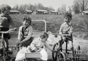 Photographs (7) of children and families at the Lydiard Camp estate, 1950s